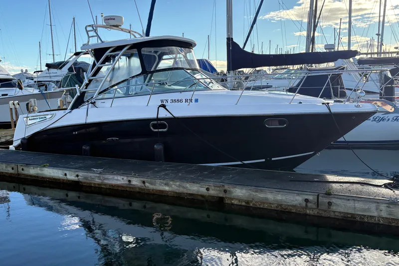 Slide: The Image of 2009 Sea Ray 290 Amberjack boat docked at marina, side view. - 18