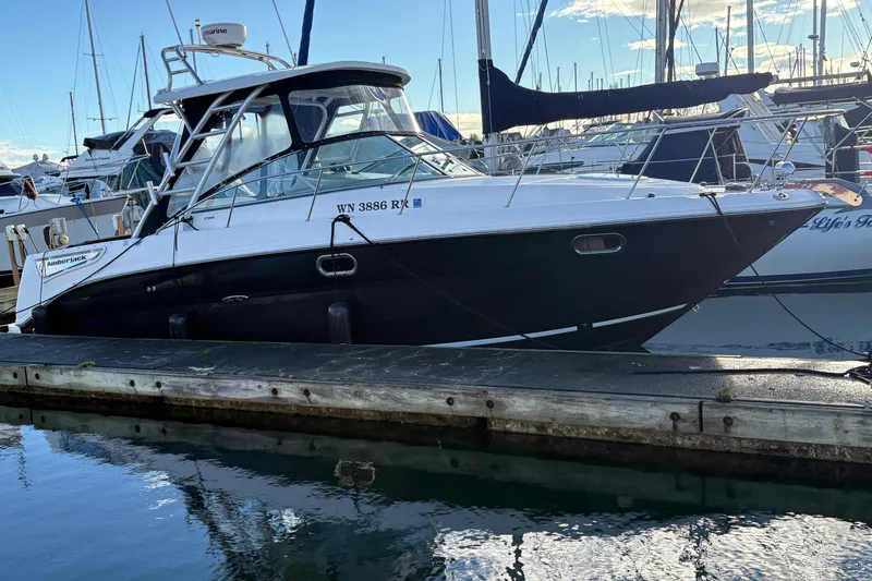 Slide: The Image of 2009 Sea Ray 290 Amberjack boat docked at marina, side view. - 21