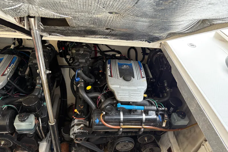 Slide: The Image of Engine compartment of a 2009 Sea Ray 290 Amberjack with twin MerCruiser engines. - 51