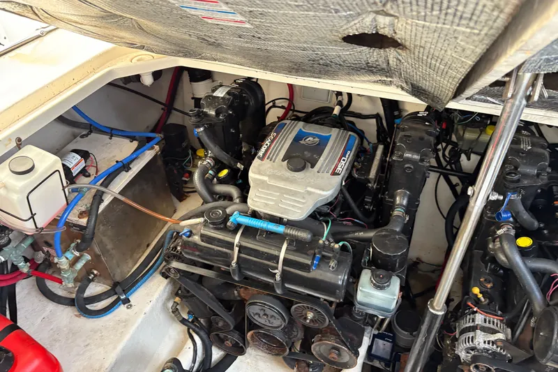 Slide: The Image of Engine compartment of 2009 Sea Ray 290 Amberjack boat, showcasing mechanical components. - 52