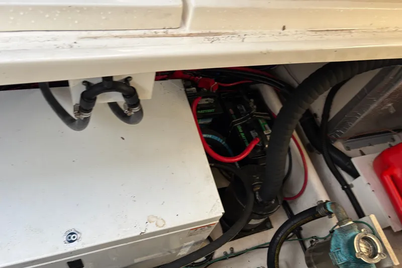Slide: The Image of Engine compartment of a 2009 Sea Ray 290 Amberjack, showing battery and wiring. - 58