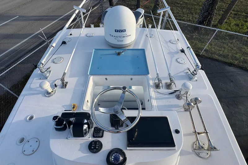 Slide: The Image of 2015 SeaHunter 41 Tournament boat helm with steering wheel and navigation equipment. - 10