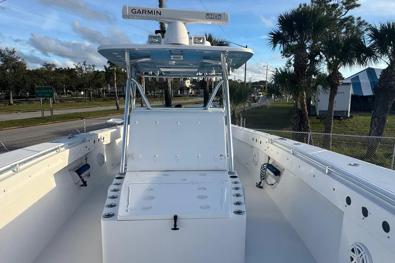 Slide: The Image of 2015 SeaHunter 41 Tournament boat with Garmin radar, docked near palm trees. - 17