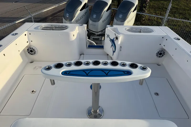 Slide: The Image of 2015 SeaHunter 41 Tournament boat deck with rod holders and Suzuki engines. - 19