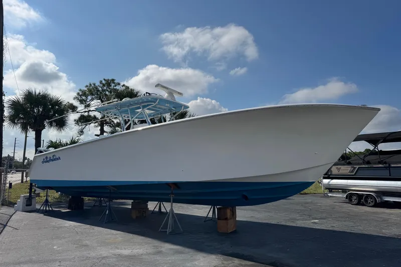 Slide: The Image of 2015 SeaHunter 41 Tournament boat on stands, clear sky background. - 2