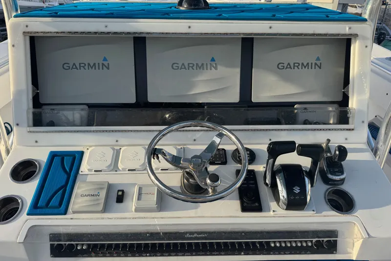 Slide: The Image of Control panel of a 2015 SeaHunter 41 Tournament boat with Garmin displays. - 20