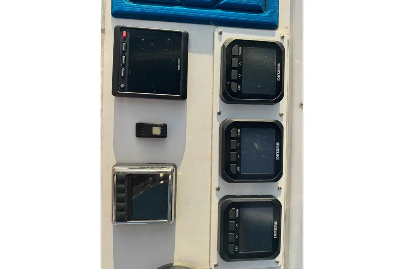 Slide: The Image of Control panel of a 2015 SeaHunter 41 Tournament boat with Suzuki displays. - 21