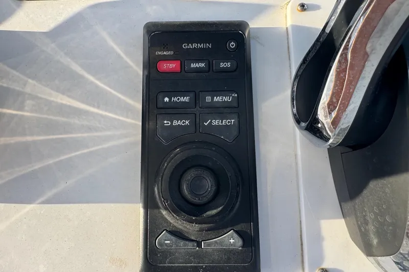 Slide: The Image of Garmin control panel on 2015 SeaHunter 41 Tournament boat dashboard. - 22