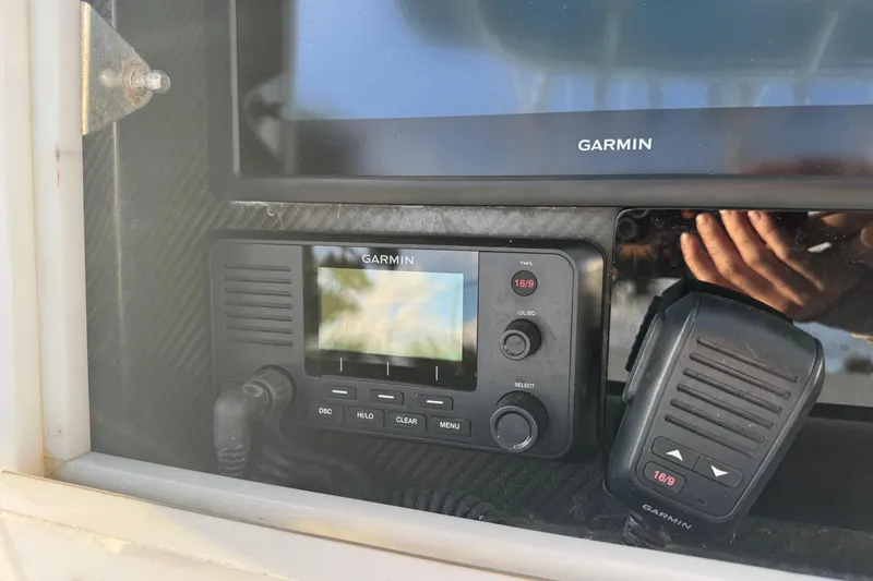 Slide: The Image of Garmin marine radio and display on 2015 SeaHunter 41 Tournament boat dashboard. - 27