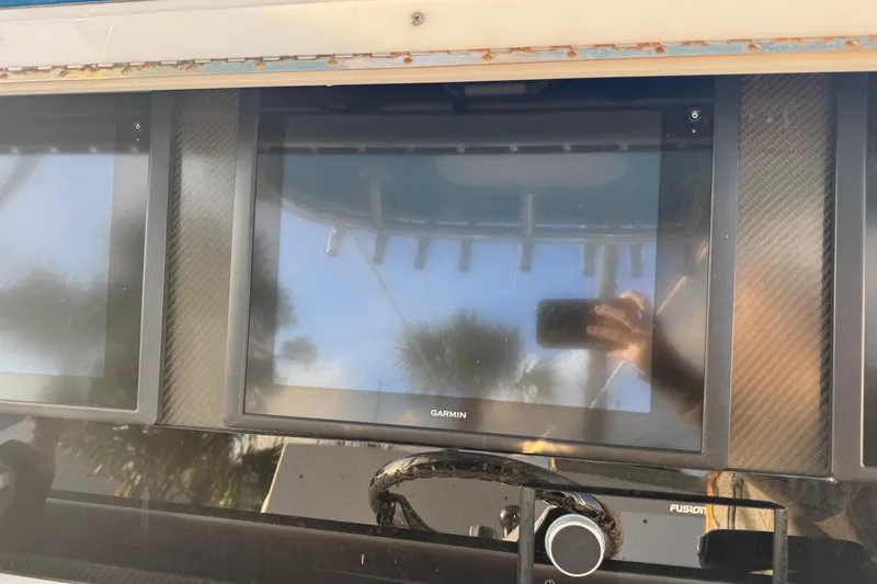 Slide: The Image of Control panel of a 2015 SeaHunter 41 Tournament boat with Garmin display. - 28