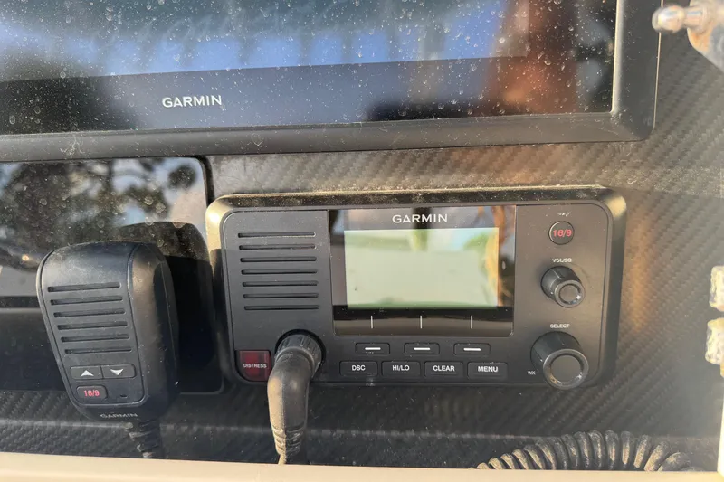 Slide: The Image of Garmin marine radio and display on 2015 SeaHunter 41 Tournament boat dashboard. - 31