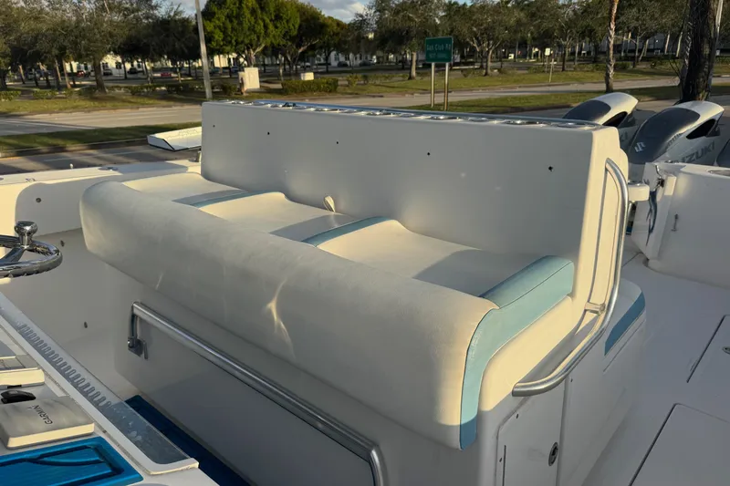 Slide: The Image of 2015 SeaHunter 41 Tournament boat with cushioned seating and steering wheel. - 33