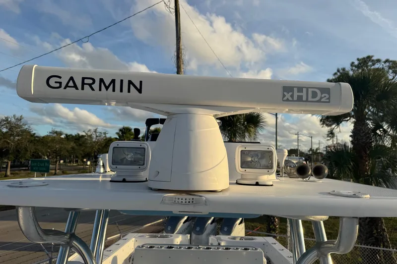 Slide: The Image of Garmin xHD2 radar on 2015 SeaHunter 41 Tournament boat under a blue sky. - 42