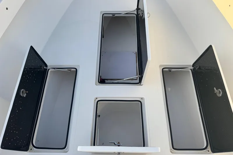 Slide: The Image of Open storage compartments on a 2015 SeaHunter 41 Tournament boat deck. - 44