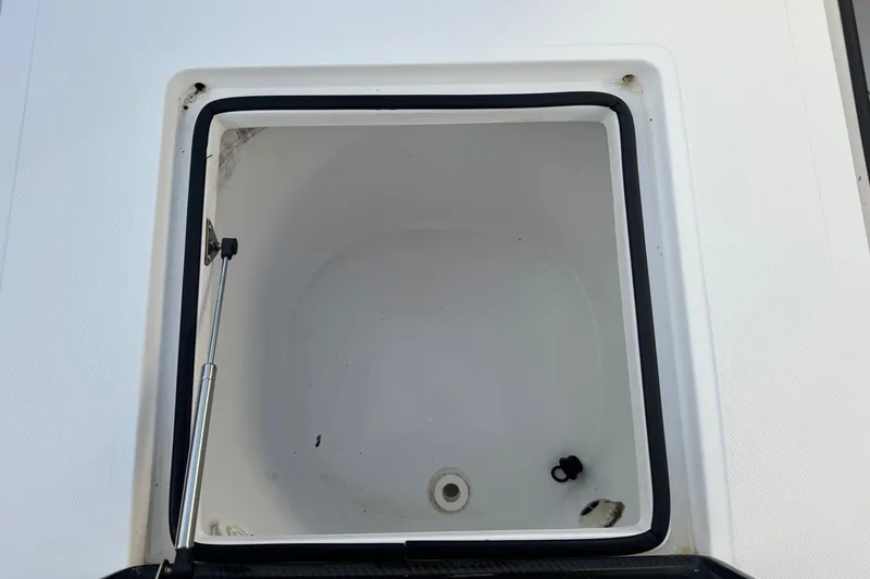 Slide: The Image of Open storage compartment on 2015 SeaHunter 41 Tournament boat. - 45