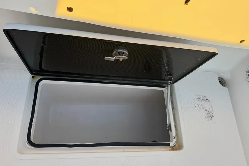 Slide: The Image of Open storage compartment on 2015 SeaHunter 41 Tournament boat deck. - 55