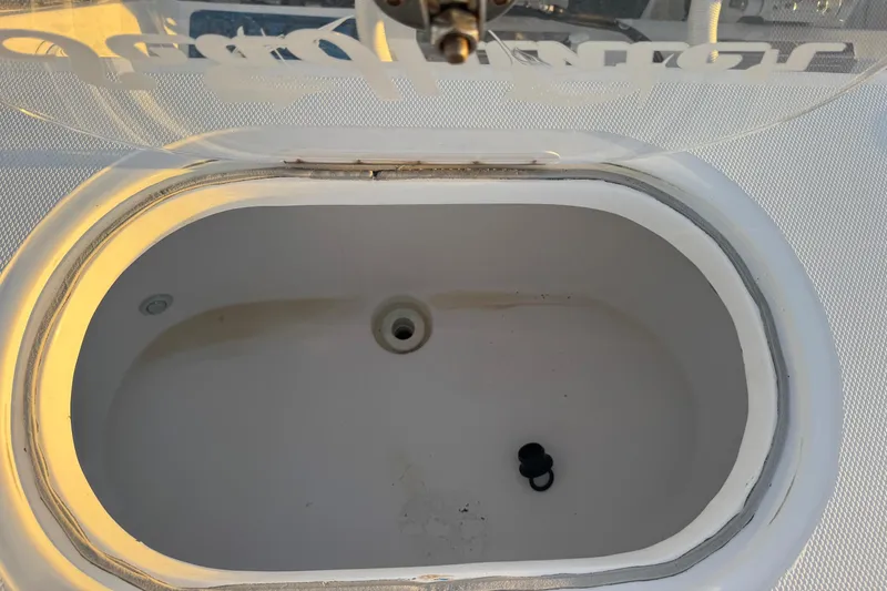 Slide: The Image of Livewell on 2015 SeaHunter 41 Tournament boat, open lid, empty interior. - 56