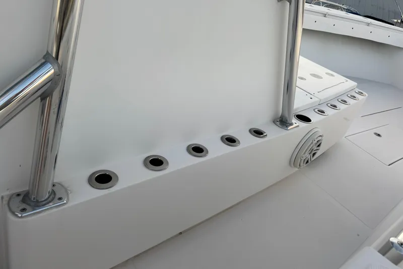 Slide: The Image of 2015 SeaHunter 41 Tournament boat deck with rod holders and stainless steel railing. - 63