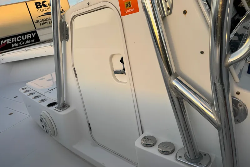 Slide: The Image of 2015 SeaHunter 41 Tournament boat interior with stainless steel railings and storage compartment. - 64