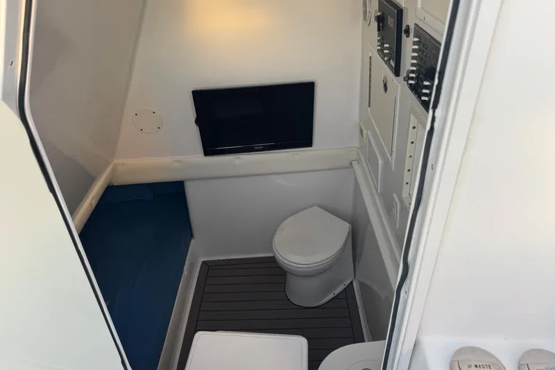Slide: The Image of Interior of 2015 SeaHunter 41 Tournament boat with toilet and control panels. - 66