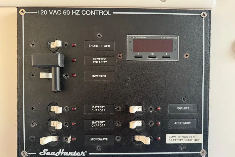 Slide: The Image of SeaHunter 41 Tournament 2015 control panel with switches and multimeter display. - 71
