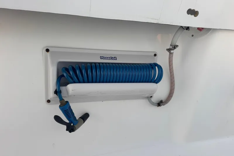Slide: The Image of Blue coiled hose on 2015 SeaHunter 41 Tournament boat, mounted on white panel. - 75