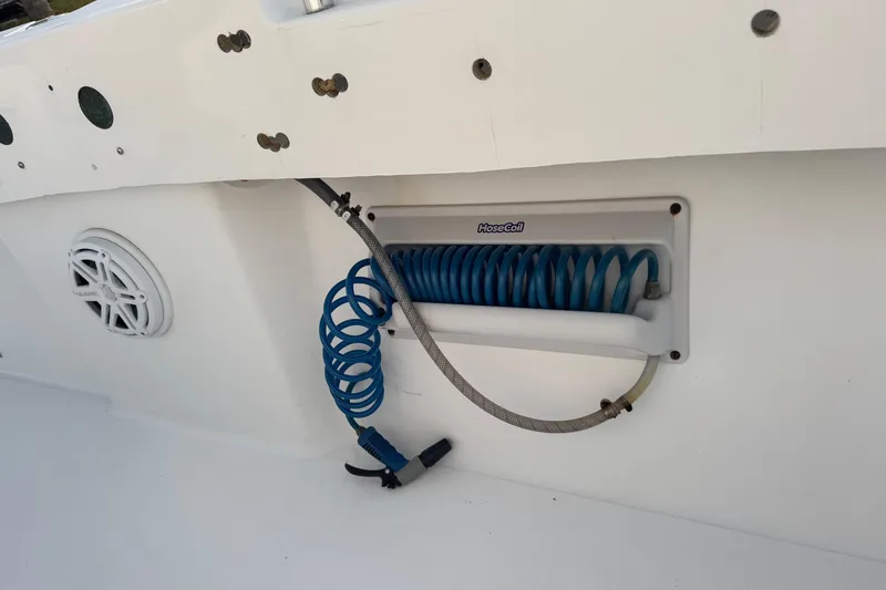 Slide: The Image of Coiled blue hose on 2015 SeaHunter 41 Tournament boat deck. - 76