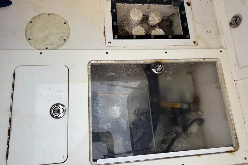 Slide: The Image of 2015 SeaHunter 41 Tournament boat deck with storage compartments and access hatches. - 78