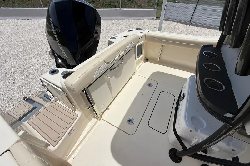 Slide: The Image of 2026 Scout 220 XSF boat interior with seating, storage, and Mercury engine. - 17