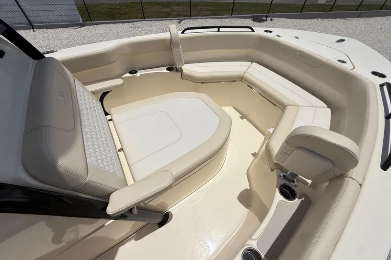 Slide: The Image of Luxurious seating area of 2026 Scout 220 XSF boat with beige upholstery. - 18