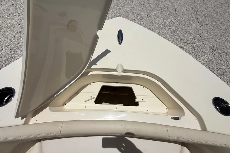 Slide: The Image of Open storage compartment on 2026 Scout 220 XSF boat deck. - 21