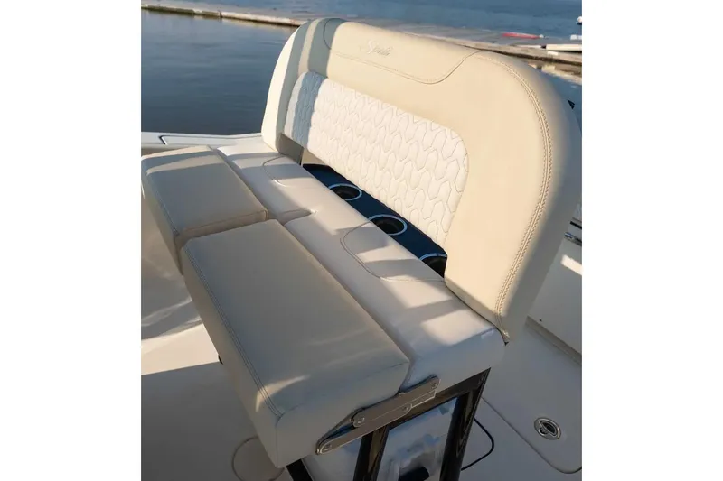 Slide: The Image of Manufacturer Provided Image: 2026 Scout 220 XSF boat seat with elegant white upholstery by the water. - 6