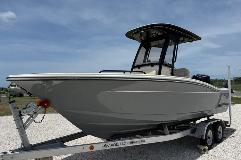 The Image of 2026 Scout 220 XSF boat on trailer under clear sky. - 8