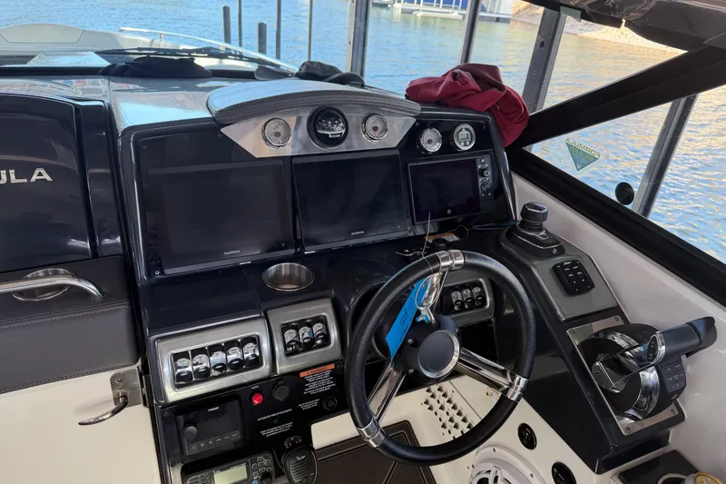 Slide: The Image of Cockpit of 2021 Formula 350 Crossover Bowrider I/O with advanced navigation controls. - 10