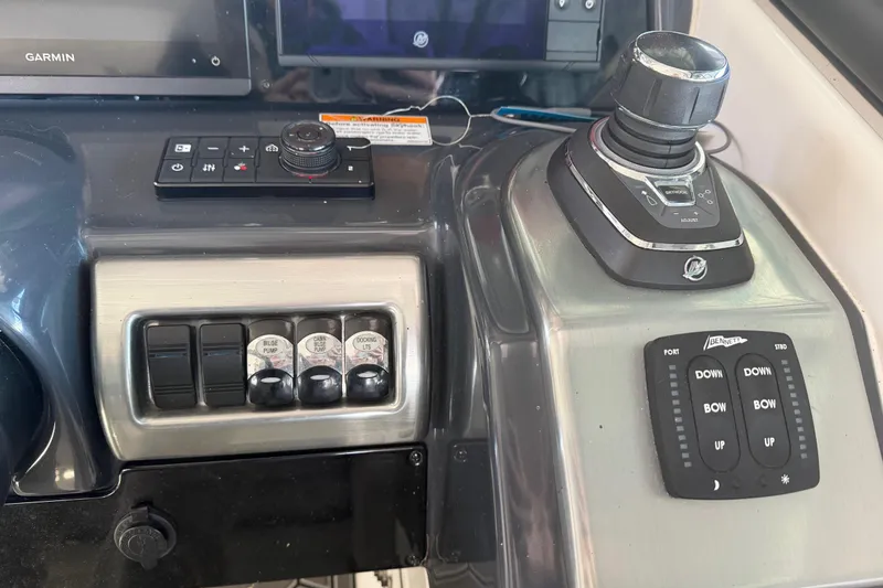 Slide: The Image of Control panel of 2021 Formula 350 Crossover Bowrider I/O with joystick and switches. - 12