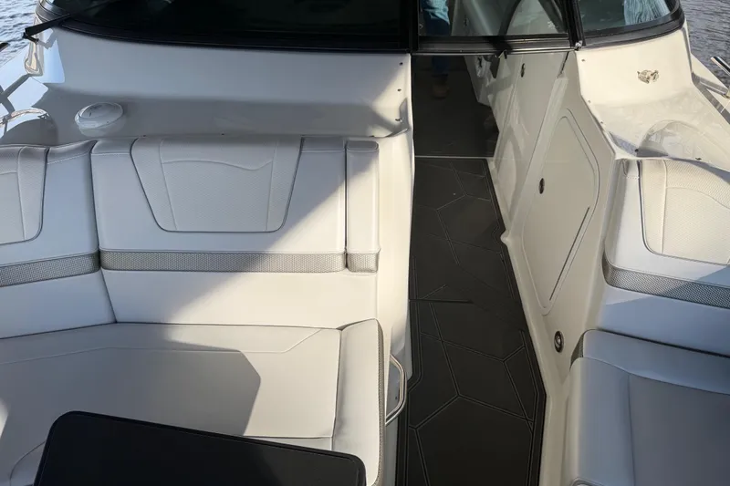 Slide: The Image of 2021 Formula 350 Crossover Bowrider I/O interior with white seating and sleek design. - 16