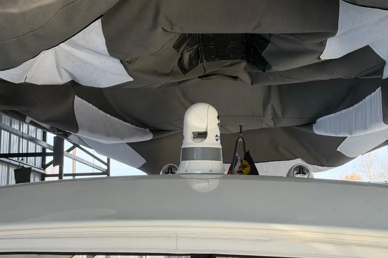 Slide: The Image of 2021 Formula 350 Crossover Bowrider I/O under protective cover in storage. - 17