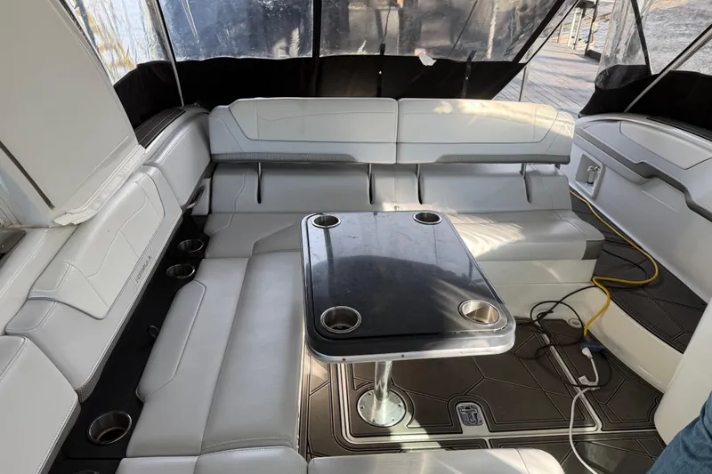 Slide: The Image of 2021 Formula 350 Crossover Bowrider I/O interior with seating and table setup. - 7