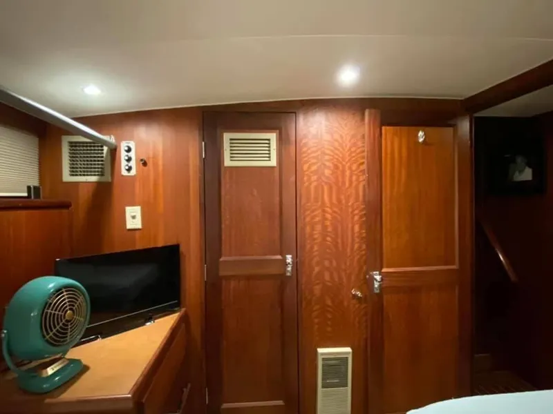 Slide: The Image of Interior of 1971 Hatteras 58 Motor Yacht with wooden walls. - 10