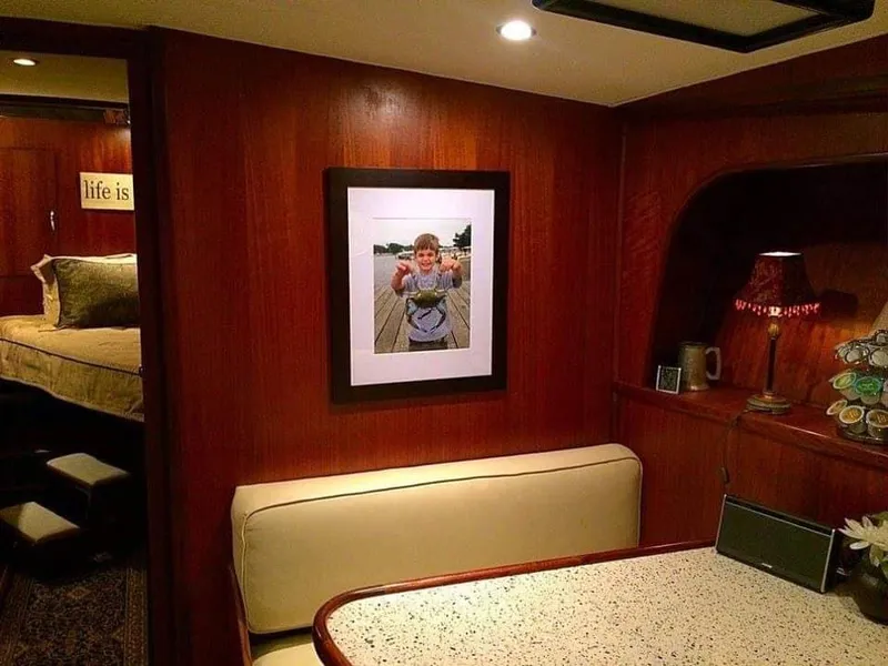 Slide: The Image of Interior of a 1971 Hatteras 58 Motor Yacht with cozy seating area. - 16