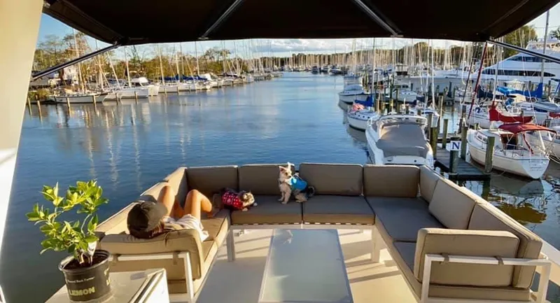 Slide: The Image of 1971 Hatteras 58 Motor Yacht docked with relaxing view. - 3