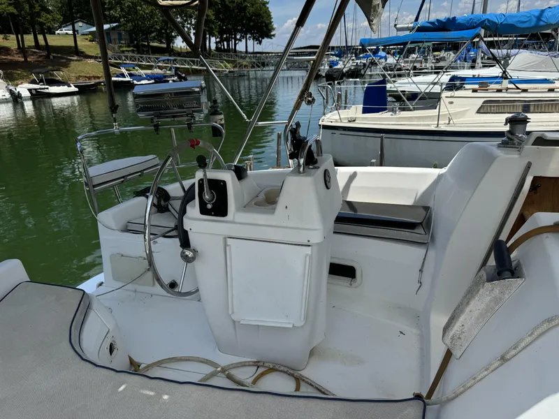 Slide: The Image of Cockpit of a 2000 Hunter 290 sailboat docked in marina. - 10