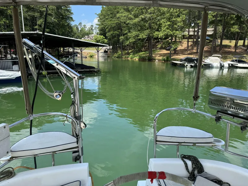 Slide: The Image of View from a Hunter 290 boat on a tranquil lake. - 11