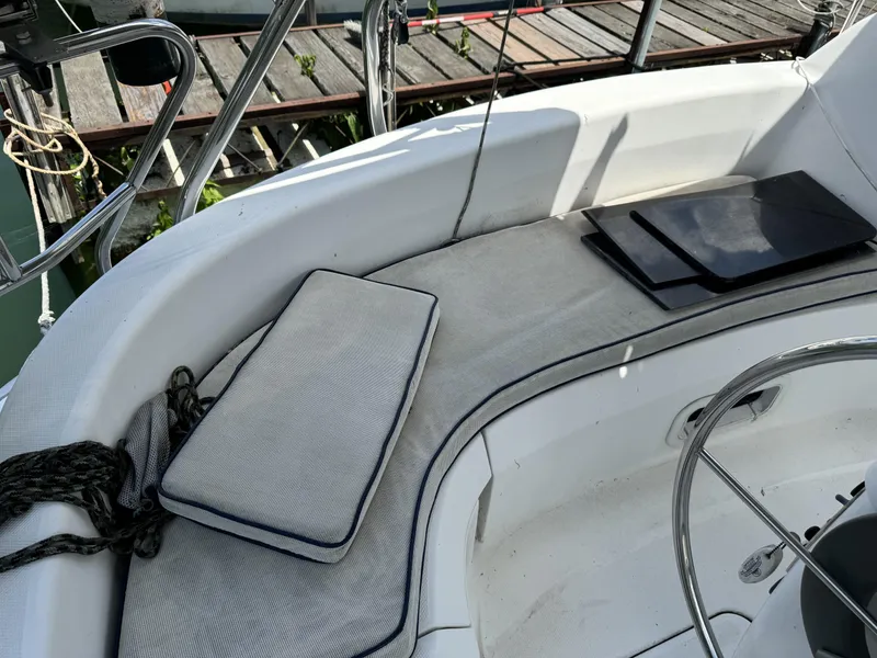 Slide: The Image of Cockpit of a 2000 Hunter 290 sailboat with cushions and steering wheel. - 15