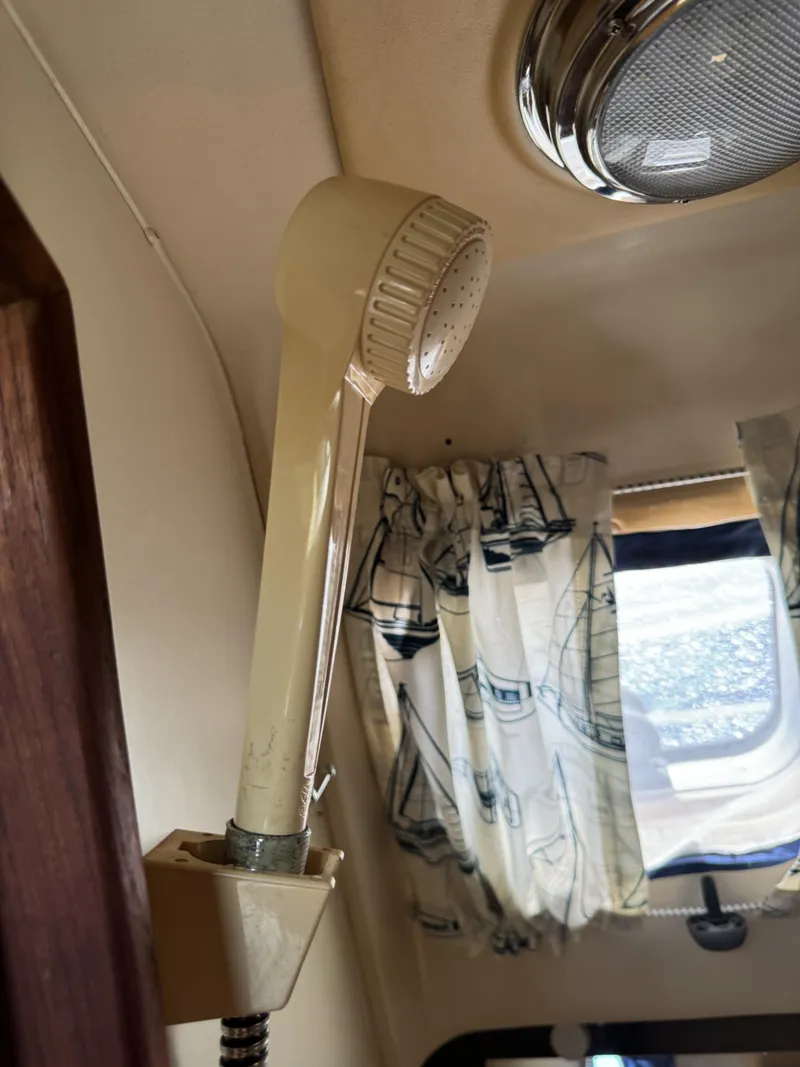 Slide: The Image of Interior of a 2000 Hunter 290 yacht with shower head. - 19