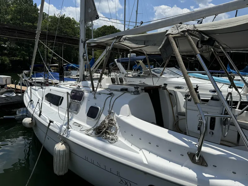 Slide: The Image of 2000 Hunter 290 sailboat docked, white deck, blue sky. - 4