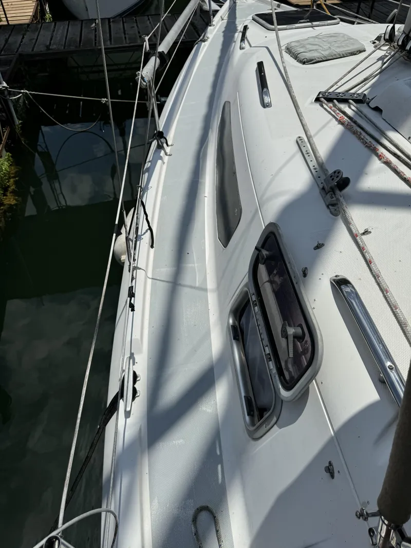 Slide: The Image of Deck of a 2000 Hunter 290 sailboat docked in harbor. - 42