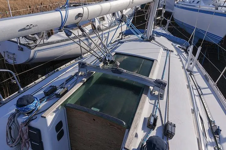 Slide: The Image of 1991 Beneteau First 310 sailboat deck with rigging and mast details. - 11