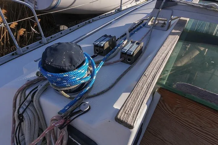 Slide: The Image of Deck of 1991 Beneteau First 310 sailboat with ropes and winches. - 14