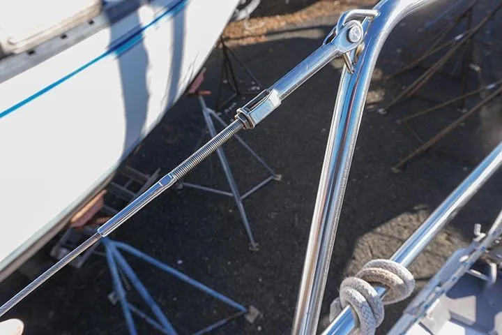 Slide: The Image of Close-up of rigging on a 1991 Beneteau First 310 sailboat, showcasing stainless steel fittings. - 18
